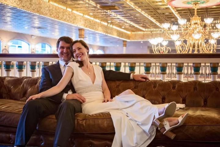 People on the Grand Chandelier Deck of the Southern Belle Riverboat