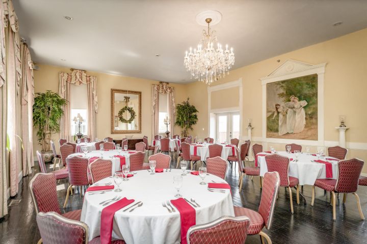 a bedroom with a bed and a chair in a room