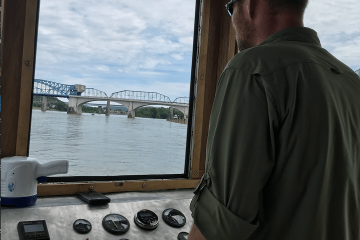 a man standing in front of an oven