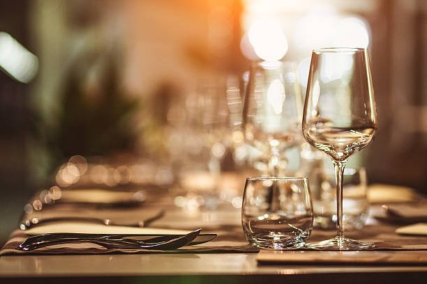 a close up of a wine glass sitting on a table