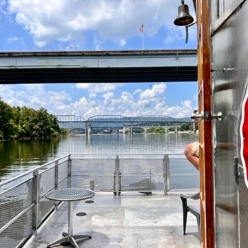 a stop sign in front of a bridge
