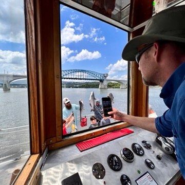 a man standing in front of a window