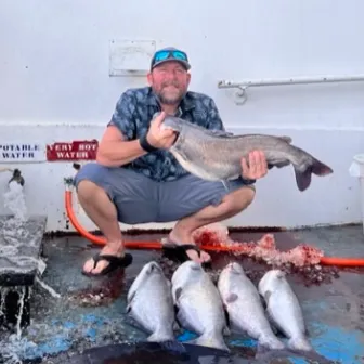 a man holding a fish